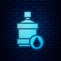 Glowing neon Big bottle with clean water icon isolated on brick wall background. Plastic container for the cooler Royalty Free Stock Photo