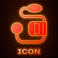 Glowing neon Blood pressure icon isolated on brick wall background. Vector Illustration
