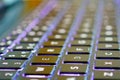 Glowing neon blue laptop keyboard.