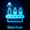 Glowing neon Brewery factory production line pouring alcoholic drink in glass bottles icon isolated on brick wall Royalty Free Stock Photo