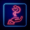 Glowing neon Caduceus snake medical symbol icon isolated on black background. Medicine and health care. Emblem for