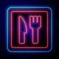 Glowing neon Cafe and restaurant location icon isolated on blue background. Fork and spoon eatery sign inside pinpoint Royalty Free Stock Photo