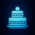 Glowing neon Cake icon isolated on brick wall background. Happy Birthday. Vector