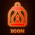 Glowing neon Camping lantern icon isolated on brick wall background. Vector