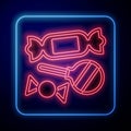Glowing neon Candy icon isolated on black background. Vector