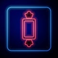 Glowing neon Candy icon isolated on blue background. Happy Halloween party. Vector