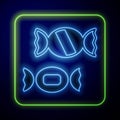 Glowing neon Candy icon isolated on blue background. Vector