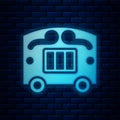 Glowing neon Circus wagon icon isolated on brick wall background. Circus trailer, wagon wheel. Vector