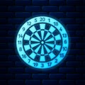 Glowing neon Classic darts board with twenty black and white sectors icon isolated on brick wall background. Dart board Royalty Free Stock Photo