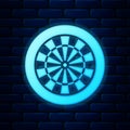 Glowing neon Classic darts board with twenty black and white sectors icon isolated on brick wall background. Dart board Royalty Free Stock Photo