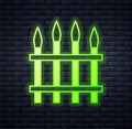 Glowing neon Classic iron fence with metal pillars icon isolated on brick wall background. Ancient wrought iron fence Royalty Free Stock Photo