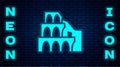 Glowing neon Coliseum in Rome, Italy icon isolated on brick wall background. Colosseum sign. Symbol of Ancient Rome