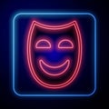 Glowing neon Comedy theatrical mask icon isolated on black background. Vector