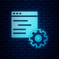 Glowing neon Computer api interface icon isolated on brick wall background. Application programming interface API Royalty Free Stock Photo