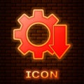 Glowing neon Cost reduction icon on brick wall background. Vector