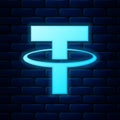 Glowing neon Cryptocurrency coin Tether USDT icon isolated on brick wall background. Physical bit coin. Digital currency