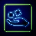 Glowing neon Cube levitating above hand icon isolated on blue background. Levitation symbol