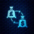 Glowing neon Currency exchange icon isolated on brick wall background. Euro and Dollar cash transfer symbol. Banking