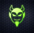 Glowing neon Devil head icon isolated on brick wall background. Happy Halloween party. Vector