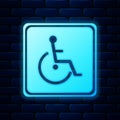 Glowing neon Disabled handicap icon isolated on brick wall background. Wheelchair handicap sign. Vector Royalty Free Stock Photo