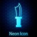 Glowing neon Diving knife icon isolated on brick wall background. Vector