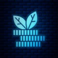 Glowing neon Dollar plant icon isolated on brick wall background. Business investment growth concept. Money savings and Royalty Free Stock Photo