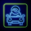 Glowing neon Eco car concept drive with leaf icon isolated on blue background. Green energy car symbol. Vector Royalty Free Stock Photo