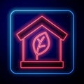 Glowing neon Eco friendly house icon isolated on black background. Eco house with leaf. Vector Royalty Free Stock Photo