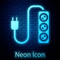 Glowing neon Electric extension cord icon isolated on brick wall background. Power plug socket. Vector Royalty Free Stock Photo