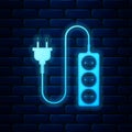 Glowing neon Electric extension cord icon isolated on brick wall background. Power plug socket. Vector Royalty Free Stock Photo