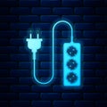 Glowing neon Electric extension cord icon isolated on brick wall background. Power plug socket. Vector Royalty Free Stock Photo