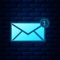 Glowing neon Envelope icon isolated on brick wall background. Received message concept. New, email incoming message, sms Royalty Free Stock Photo