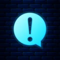 Glowing neon Exclamation mark in circle icon isolated on brick wall background. Hazard warning symbol. FAQ sign. Copy Royalty Free Stock Photo