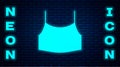 Glowing neon Female crop top icon isolated on brick wall background. Undershirt. Vector