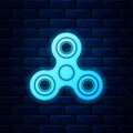 Glowing neon Fidget spinner icon isolated on brick wall background. Stress relieving toy. Trendy hand spinner. Vector Royalty Free Stock Photo