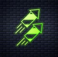 Glowing neon Firework rocket icon isolated on brick wall background. Concept of fun party. Explosive pyrotechnic symbol Royalty Free Stock Photo