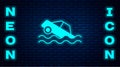 Glowing neon Flood car icon isolated on brick wall background. Insurance concept. Flood disaster concept. Security Royalty Free Stock Photo