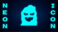 Glowing neon Funny and scary ghost mask for Halloween icon isolated on brick wall background. Happy Halloween party