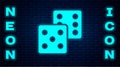Glowing neon Game dice icon isolated on brick wall background. Casino gambling. Vector Royalty Free Stock Photo