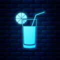 Glowing neon Glass of juice icon isolated on brick wall background. Orange slice and tube for drinking. Healthy organic Royalty Free Stock Photo