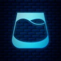 Glowing neon Glass of whiskey icon isolated on brick wall background. Vector