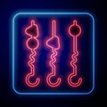 Glowing neon Grilled shish kebab on skewer stick icon isolated on black background. Meat kebab on skewer stick. Picnic Royalty Free Stock Photo