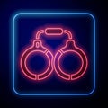 Glowing neon Handcuffs icon isolated on blue background. Vector