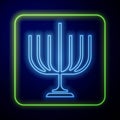 Glowing neon Hanukkah menorah icon isolated on blue background. Hanukkah traditional symbol. Holiday religion, jewish