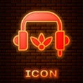 Glowing neon Headphones for meditation icon isolated on brick wall background. Vector Royalty Free Stock Photo