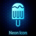 Glowing neon Ice cream on stick icon isolated on brick wall background. Sweet symbol. Vector Royalty Free Stock Photo