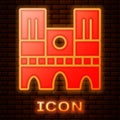 Glowing neon Landmark of France Notre Dame de Paris icon isolated on brick wall background. Vector