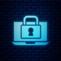 Glowing neon Laptop and lock icon isolated on brick wall background. Computer and padlock. Security, safety, protection