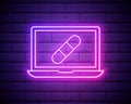 Glowing neon Laptop and patch or plaster icon isolated on brick wall background. Laptop service concept. Adjusting app, setting Royalty Free Stock Photo