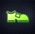 Glowing neon Leprechaun boot icon isolated on brick wall background. Happy Saint Patricks day. National Irish holiday